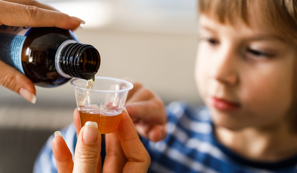 A-child-getting-ready-to-have-cough-syrup